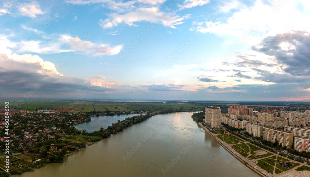 the Kuban River and Lake Brzegokai near the city of Krasnodar on a summer evening before sunset - panoramic aerial view