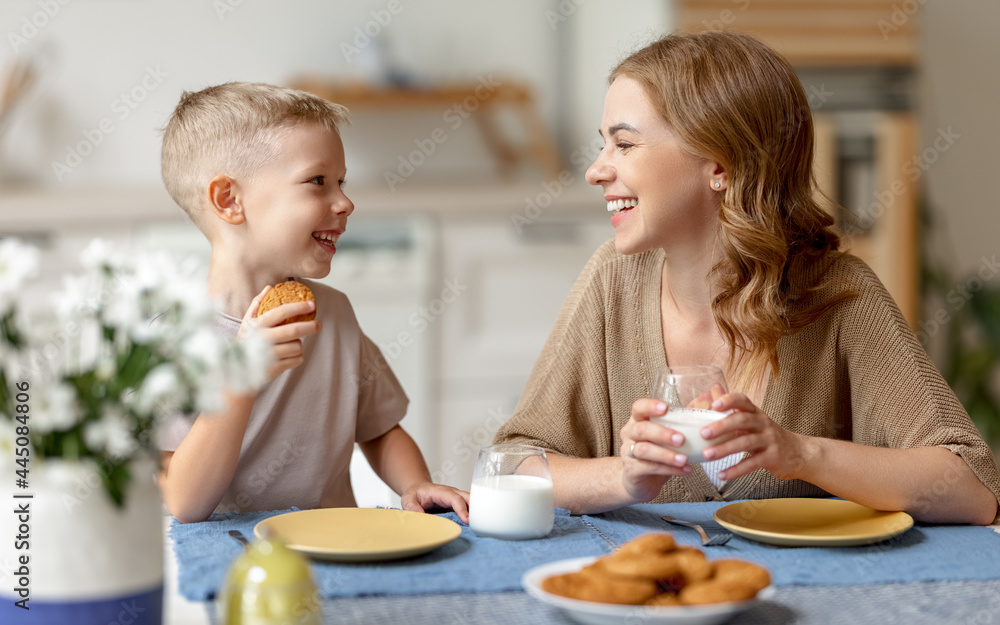 Happy mother and son laughing during breakfast Happy mother and son laughing during breakfast