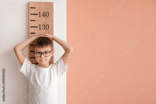 Little boy measuring height...
