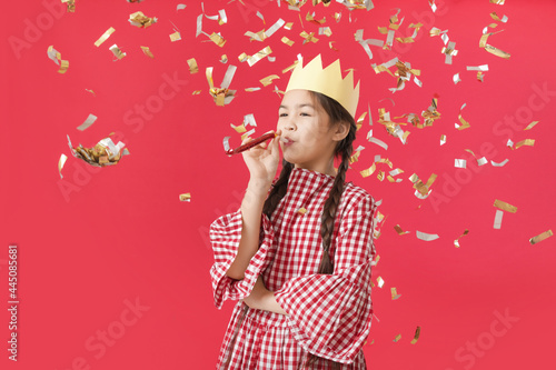 Cute little girl celebratin...
