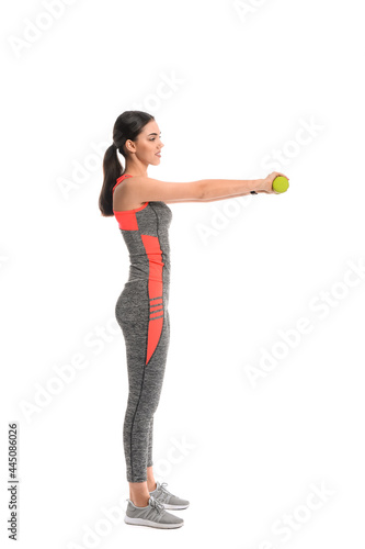 Sporty female coach with dumbbells on white background