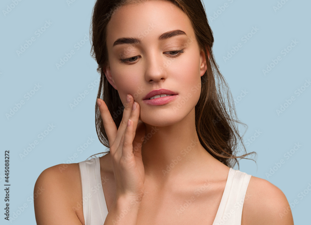 Beauty woman face natural make up healthy skin over color background Beauty woman face natural make up healthy skin over color background