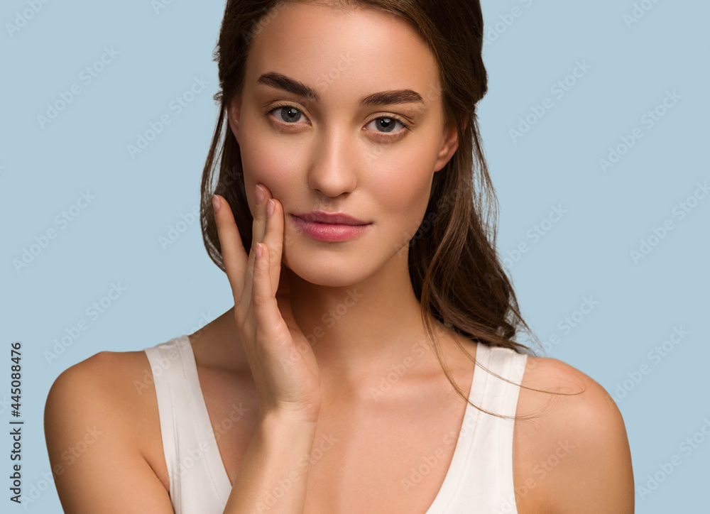 Beauty woman face natural make up healthy skin over color background Beauty woman face natural make up healthy skin over color background