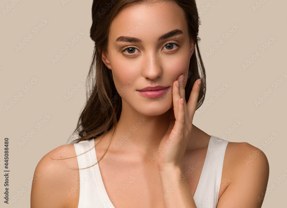Beauty woman face natural make up healthy skin over color background Beauty woman face natural make up healthy skin over color background