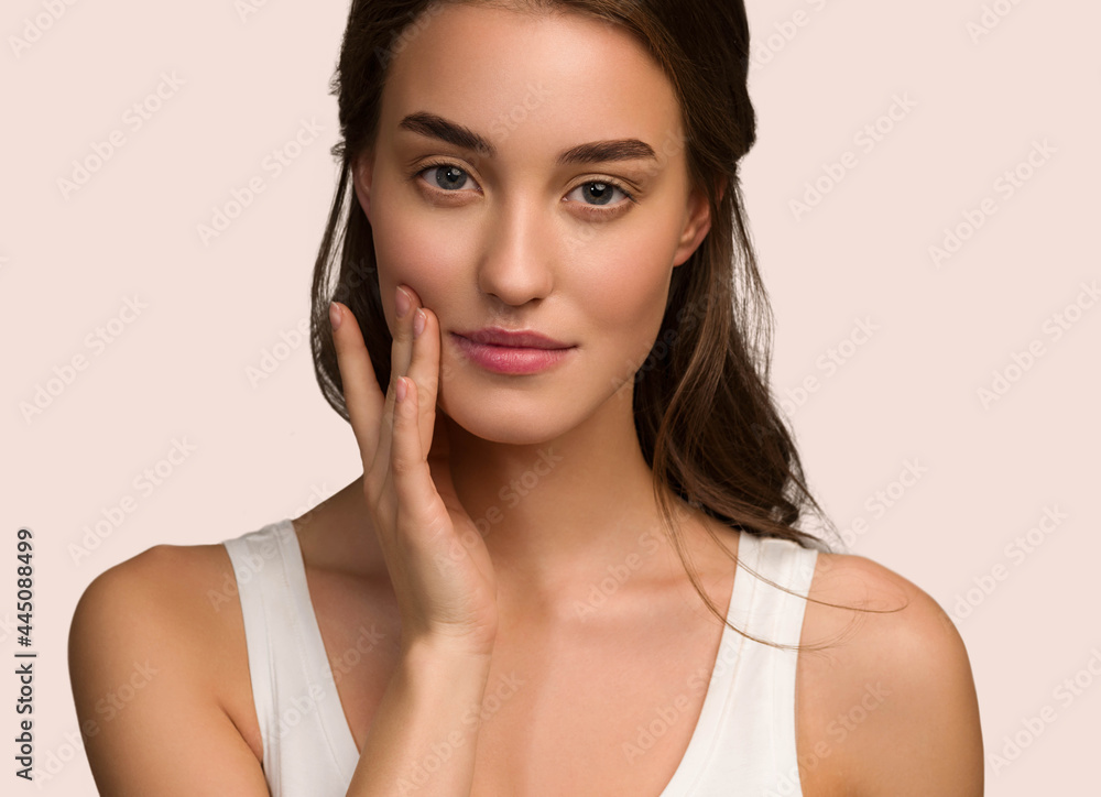Beauty woman face natural make up healthy skin over color background Beauty woman face natural make up healthy skin over color background