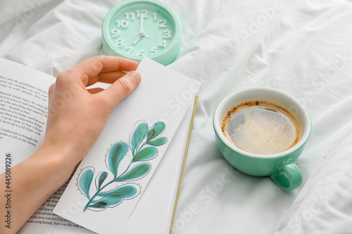 Woman with bookmark and cup...