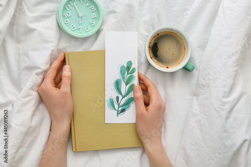 Woman with bookmark and cup...