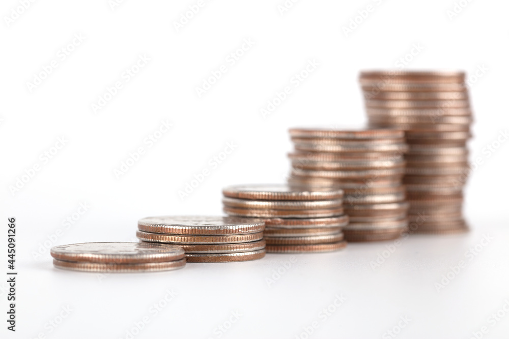A row of increasing dollar coins on white background A row of increasing dollar coins on white background