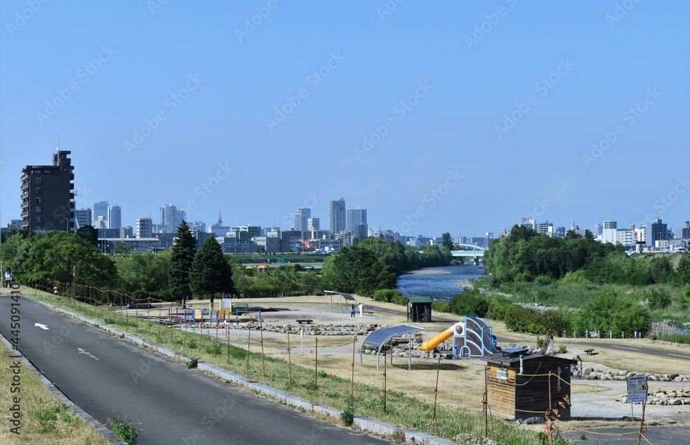 Fototapeta premium The central Sapporo city view from the Toyohira Water Garden in Sapporo Japan