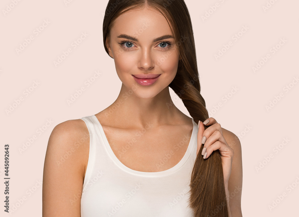 Beautiful woman with long smooth brunette hair clean beautiful skin