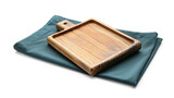 Wooden board and fabric napkin on white background