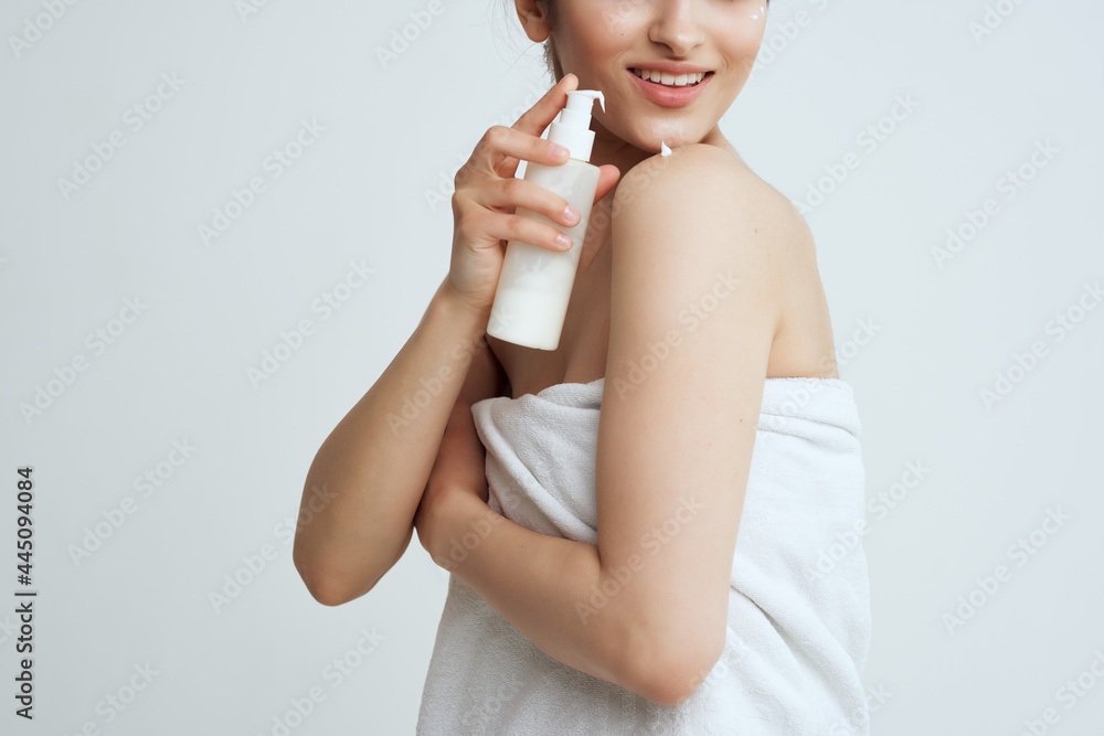 woman with lotion skin care spa treatments naked shoulders woman with lotion skin care spa treatments naked shoulders