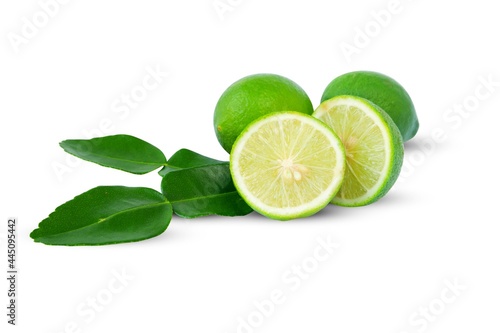 Lime(Citrus × aurantifolia) with slices or slices and leaves, isolated on a white background