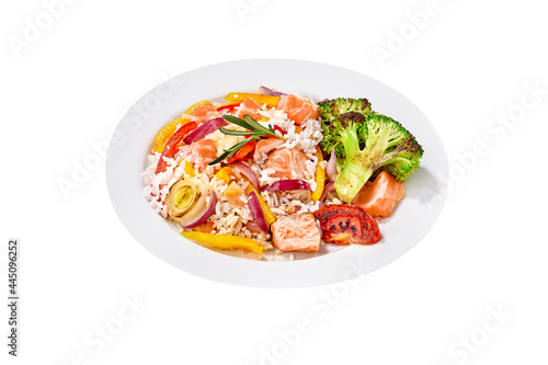 Rice pilaf with salmon and vegetables isolated on white