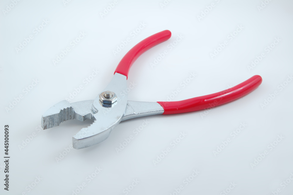 Stainless steel chrome shiny metal pliers tool with red grip Stainless steel chrome shiny metal pliers tool with red grip