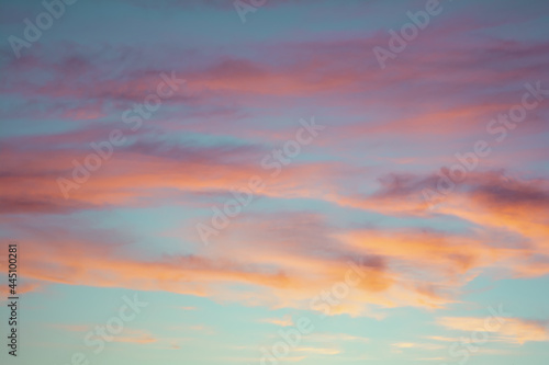 Bright colorful sky at sunset in orange pink purple and blue colors. © Chetgal 