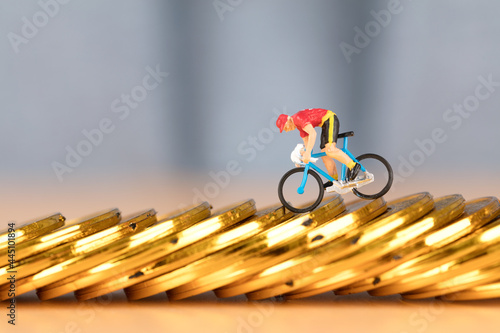 Characters who are trying hard to ride on gold coins photo