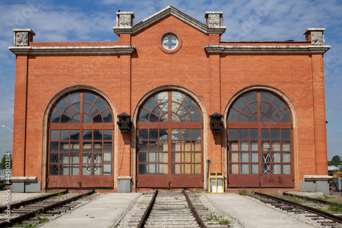 The old locomotive depot. The high gates of the old brick locomotive depot.