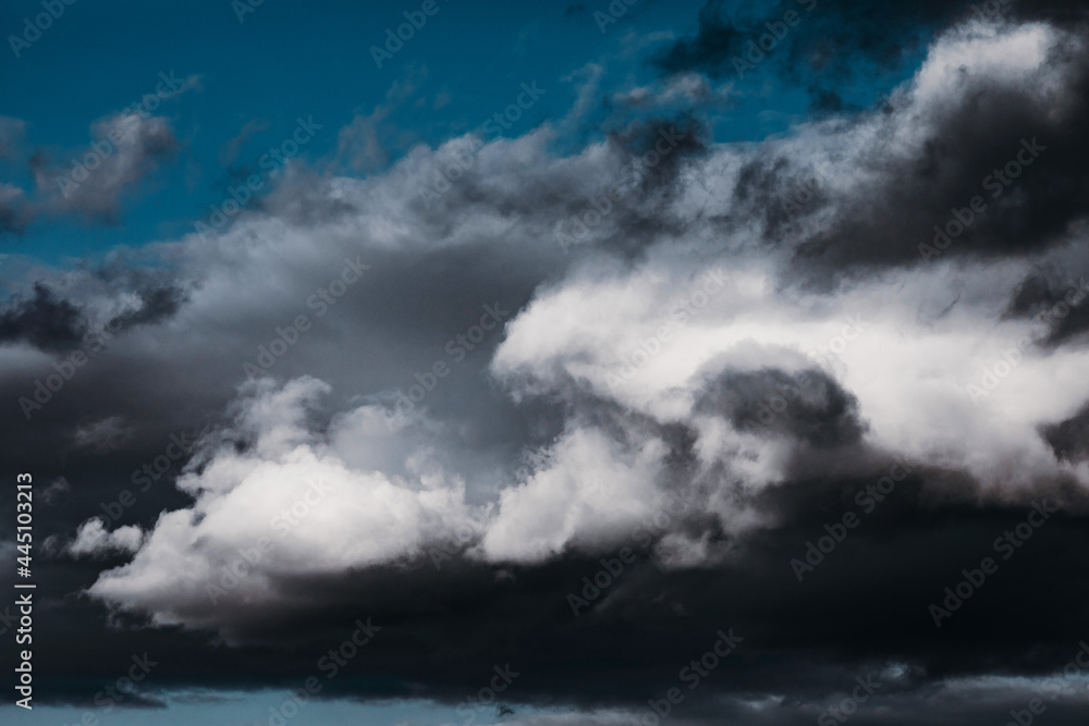 Background with gloomy gray storm clouds, texture for design, clouds with space to insert text. Bad weather with gloomy cumulus clouds Background with gloomy gray storm clouds, texture for design, clouds with space to insert text. Bad weather with gloomy cumulus clouds