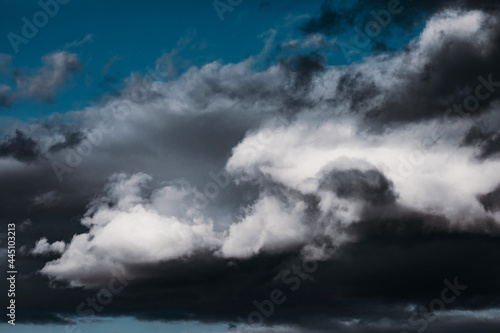 Background with gloomy gray storm clouds, texture for design, clouds with space to insert text. Bad weather with gloomy cumulus clouds