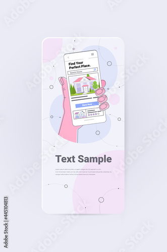 human hand using mobile app for searching houses for renting or buying online real estate property management
