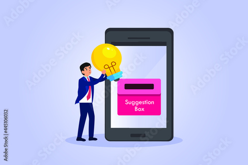 Suggestion vector concept. Businessman putting a light bulb into online suggestion box on the mobile phone