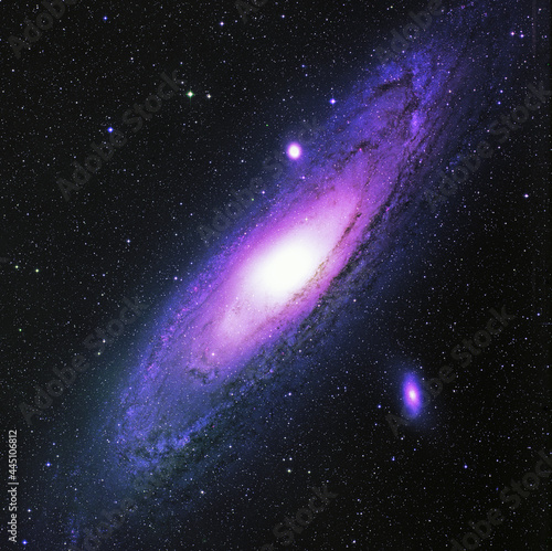 Fototapeta Naklejka Na Ścianę i Meble -  Aesthetic background with the Andromeda Nebula, bright stars, a galaxy with purple toning and a place to insert text
