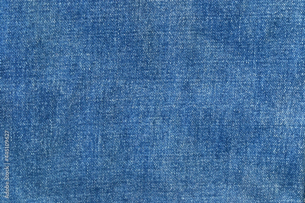 The texture of blue denim fabric The texture of blue denim fabric