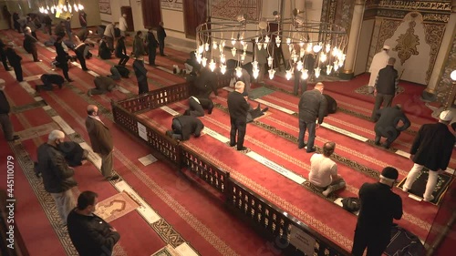 Muslim eid congregation praying.Mosque teacher imam is reading the Quran.Reads Qur'an interior god religion mysterious religious islam moslem place of worship prayer temple azan salaah spirituality 4K