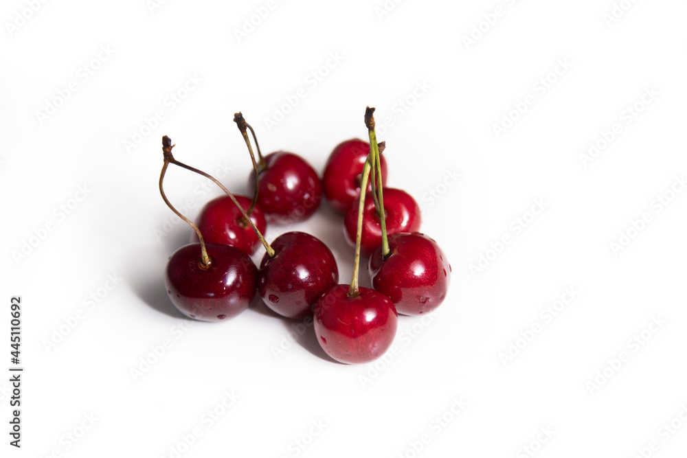 Red ripe sweet cherry on an isolated background. Red ripe sweet cherry on an isolated background.