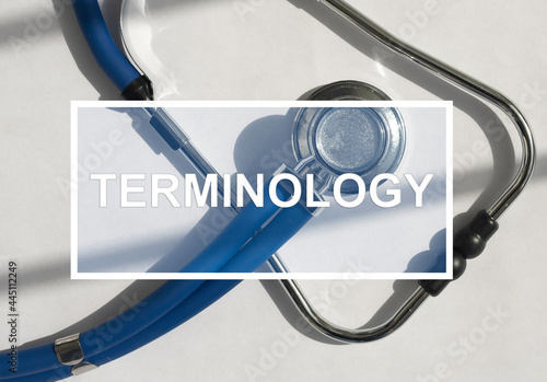 Medical terminology text on stethoscope. Medicine glossary concept photo