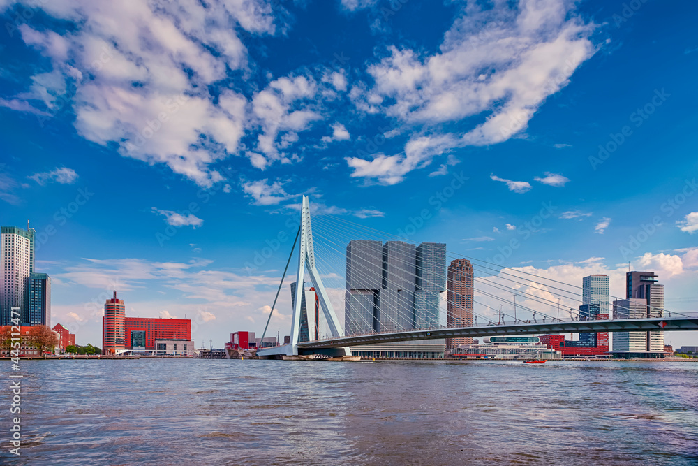 Dutch Travel Concepts. Attractive View of Renowned Erasmusbrug (Swan Bridge) in  Rotterdam in front of Port and Harbour. Picture Made At Daytime.