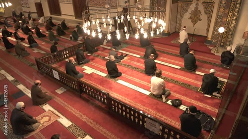 Muslim eid congregation praying.Mosque teacher imam is reading the Quran.Reads Qur'an interior god religion mysterious religious islam moslem place of worship prayer temple azan salaah spirituality 4K