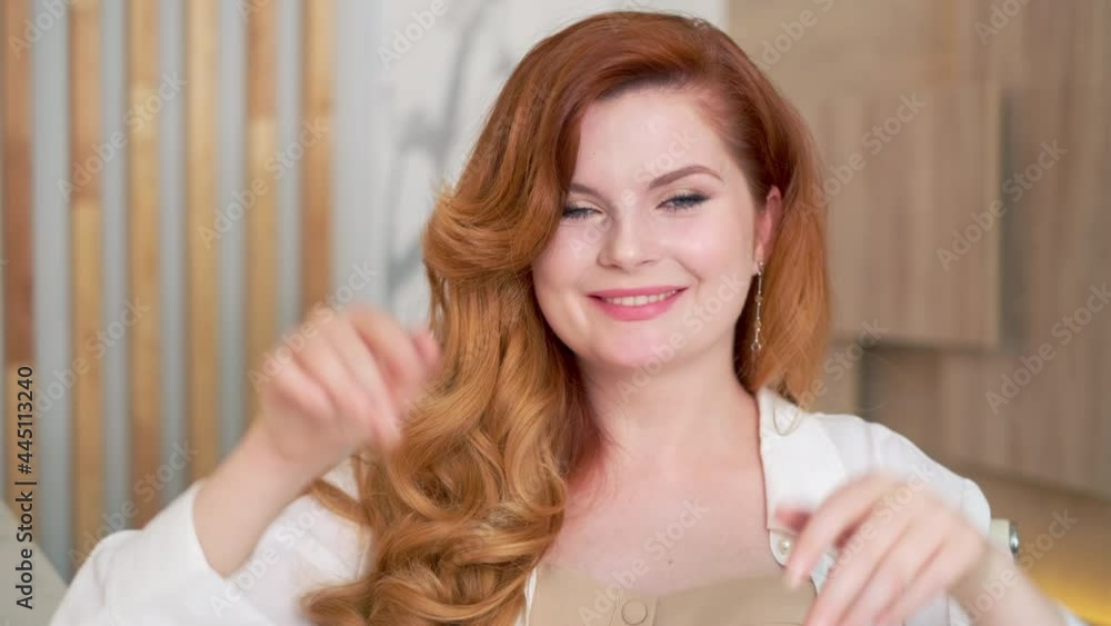 Cheerful businesswoman waving hands and winking Cheerful businesswoman waving hands and winking