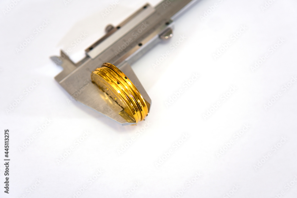Tool to measure the thickness of a stack of gold coins Tool to measure the thickness of a stack of gold coins