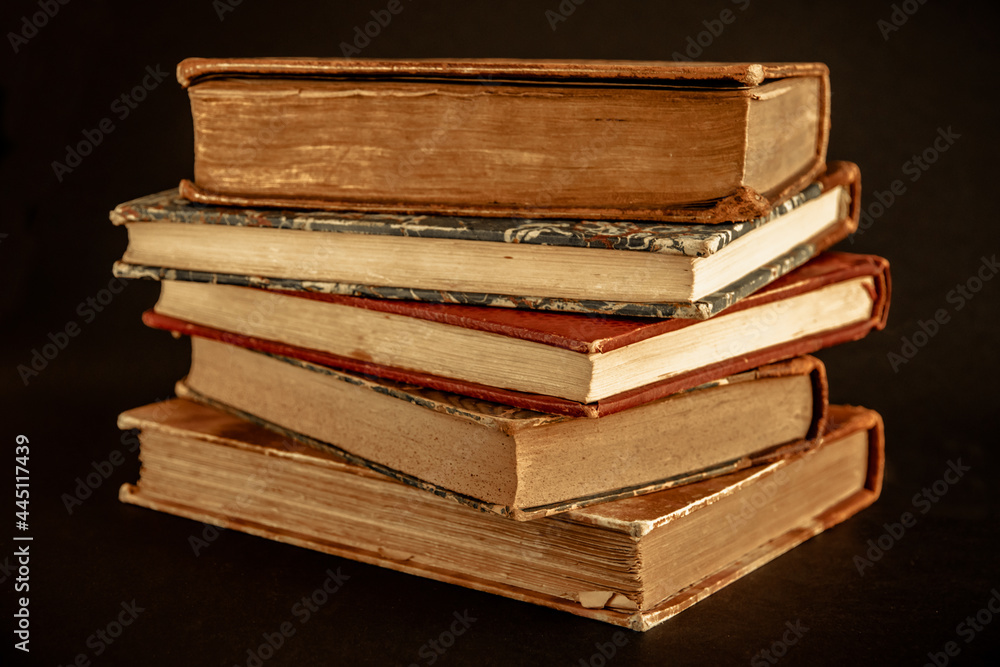 Stack of old books on black background Stack of old books on black background