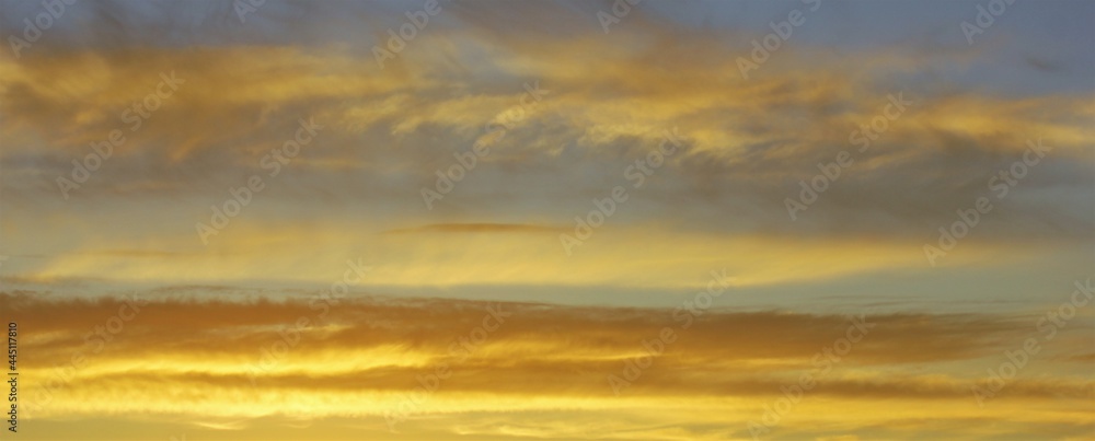 Panoramic sunset with yellow clouds Panoramic sunset with yellow clouds