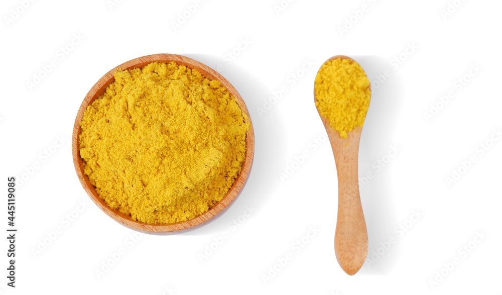 Turmeric powder with wooden bowl and wooden spoon isolated on white background,Top view Turmeric powder with wooden bowl and wooden spoon isolated on white background,Top view