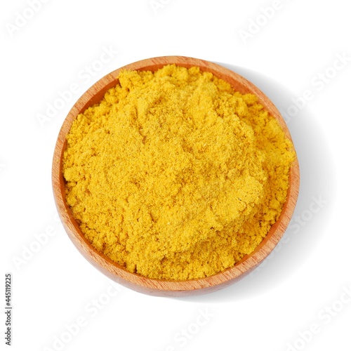 Turmeric powder with wooden bowl isolated on white background,Top view