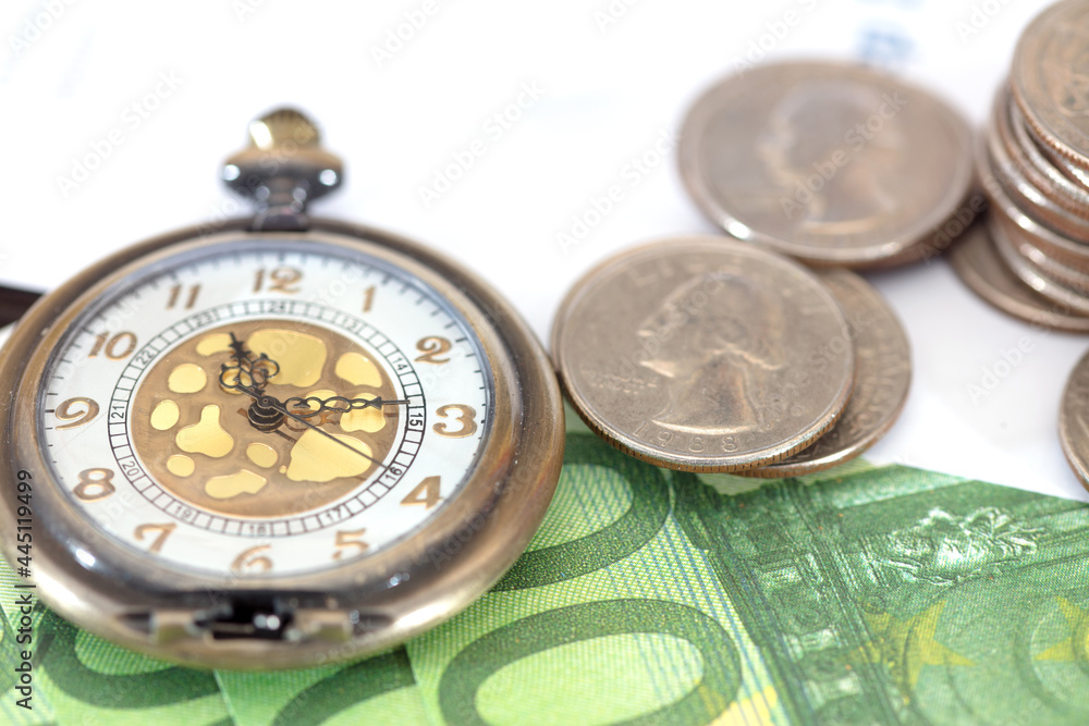 Currency and a pocket watch on the file