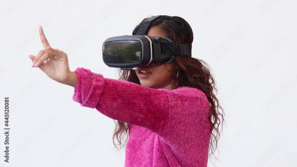 Beautiful woman touching air during the VR experience isolated on white background. Beautiful woman touching air during the VR experience isolated on white background.