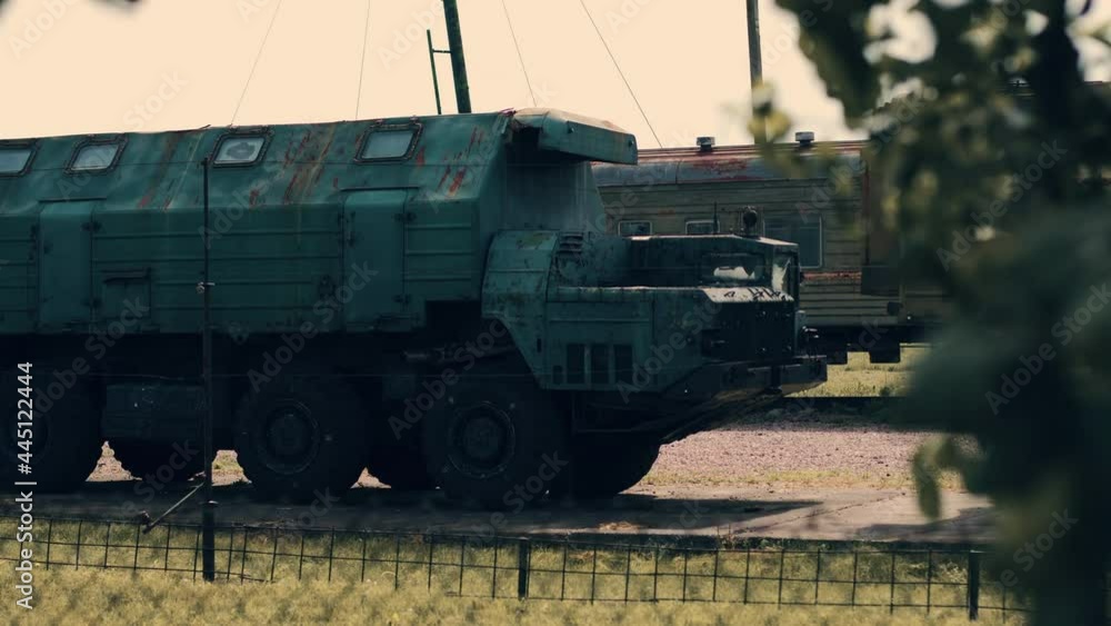 Mobile military armored vehicles stand in a column. The cars have ...