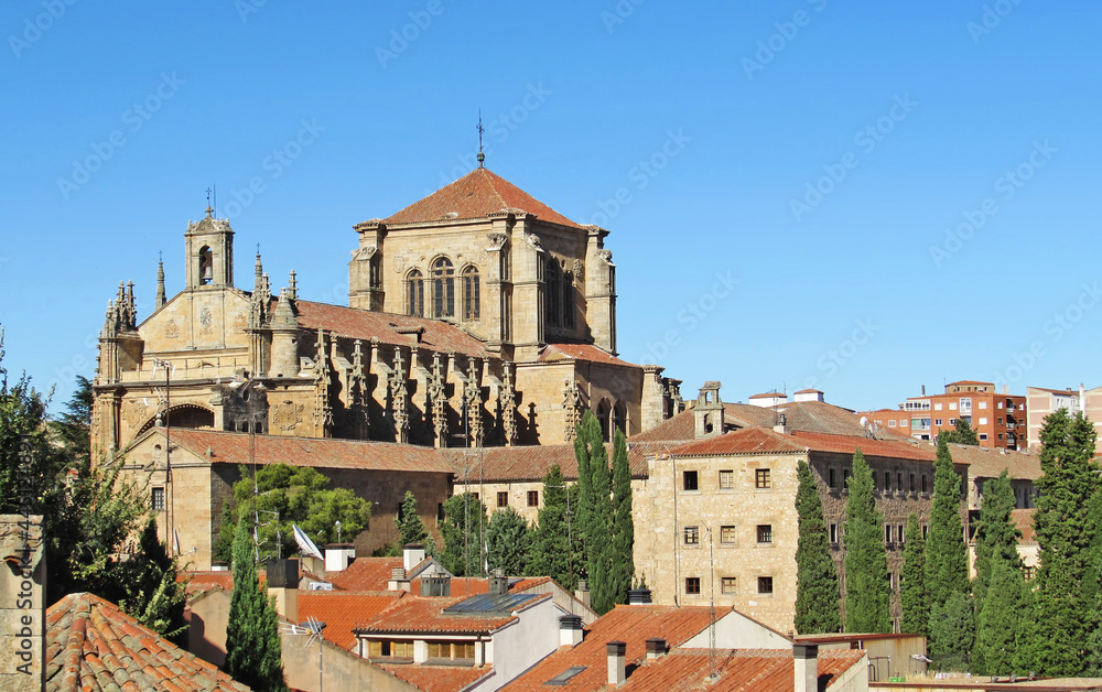 The top of Convento de San Esteban towering over the roofs of Salamanca, Spain.