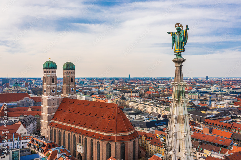 Aerial view of Munich: Muenchner Kindl on top of the New Town Hall and Frauenkirche - obrazy, fototapety, plakaty 