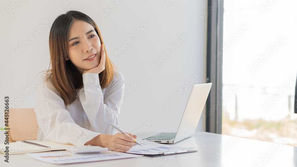 Accountants use calculators and computers holding pens and business people analyze financial data and graph reports. financial accounting concept Accountants use calculators and computers holding pens and business people analyze financial data and graph reports. financial accounting concept