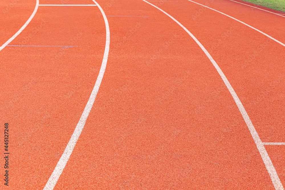 The curved lane in running track or athlete track in stadium. Running track is a rubberized artificial running surface for track and field athletics