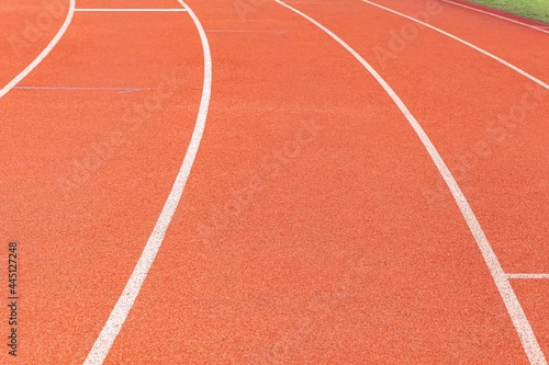 The curved lane in running track or athlete track in stadium. Running track is a rubberized artificial running surface for track and field athletics