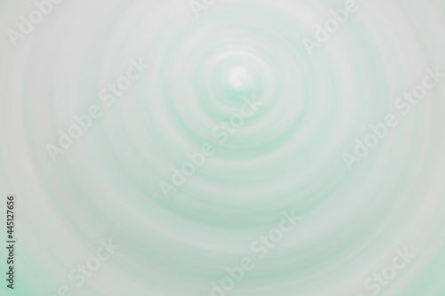 Abstract blurred background with rotating turbulent vortex. The backing for the slide cover is in soothing pastel colors. Soft template for text on the topic of business, beauty and cosmetics