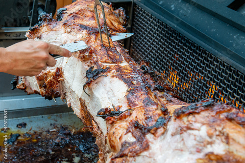 Pig roasted to golden brown on the fire 