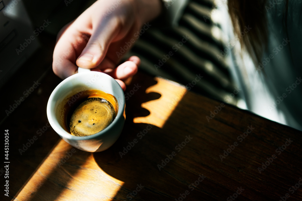 Young caucasian woman at a coffee shop